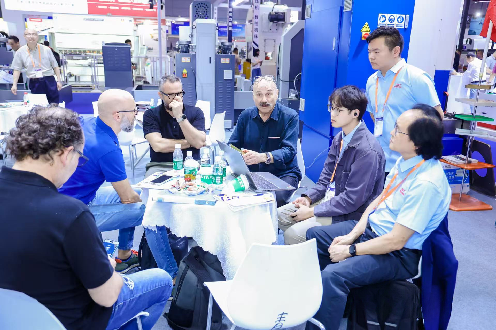 International buyer reviewing advanced manufacturing equipment at an ITES exhibitor booth